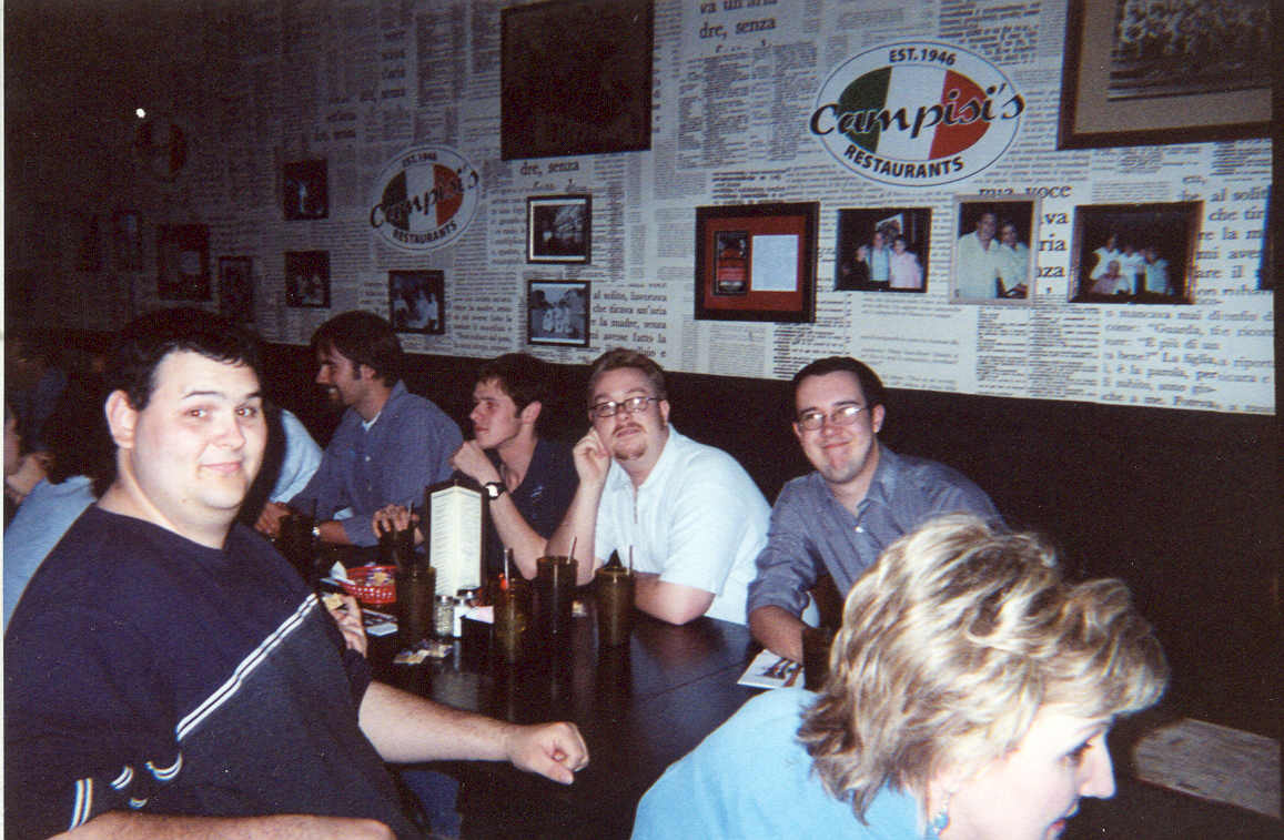 picture of a group of men sitting around a table at a restaurant