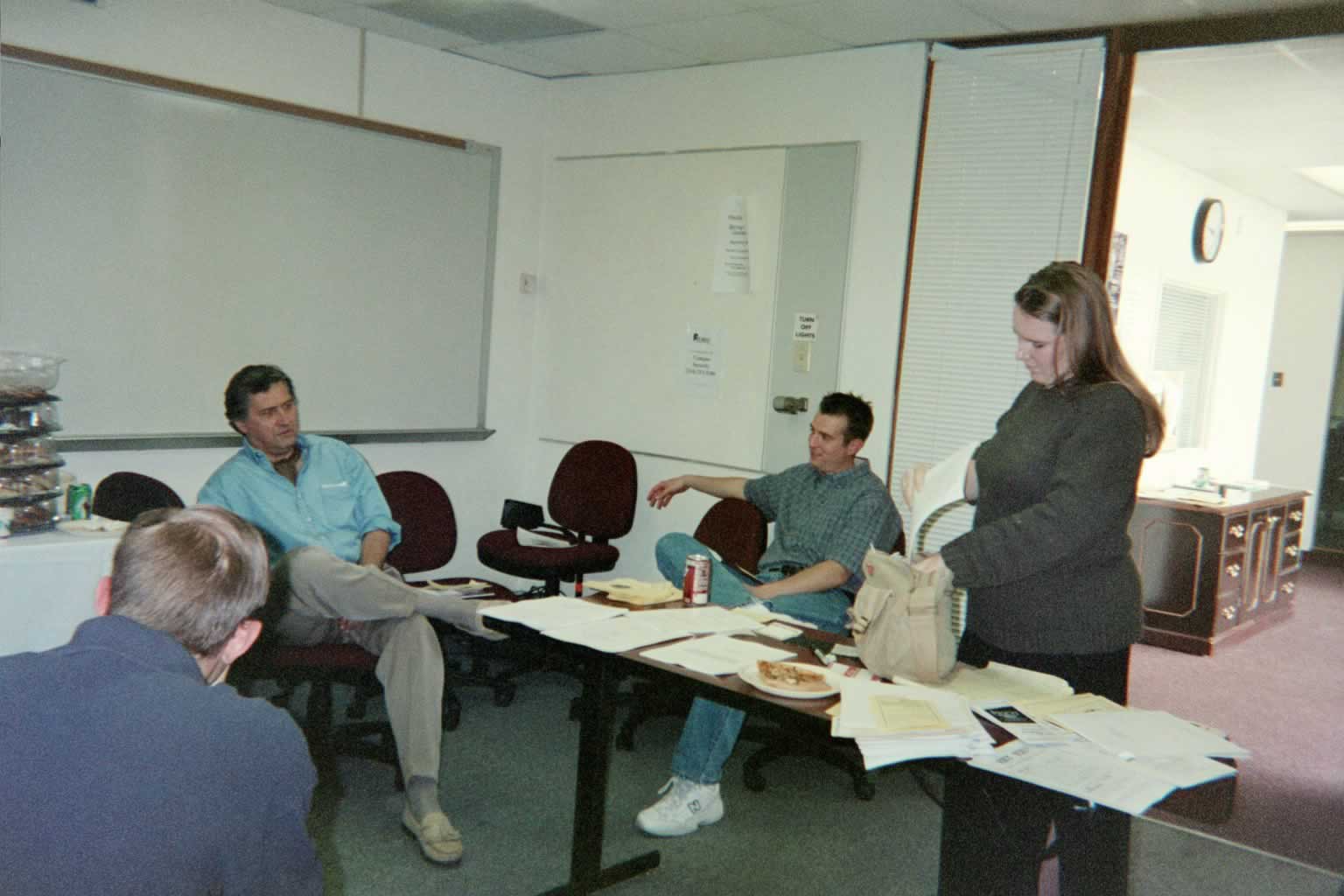 picture of Paul Marshal sitting and talking while others are sitting around him