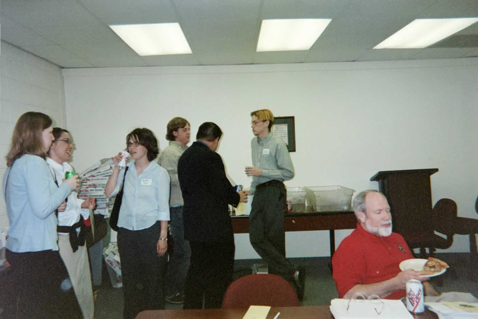 picture of students and professors talking and eating