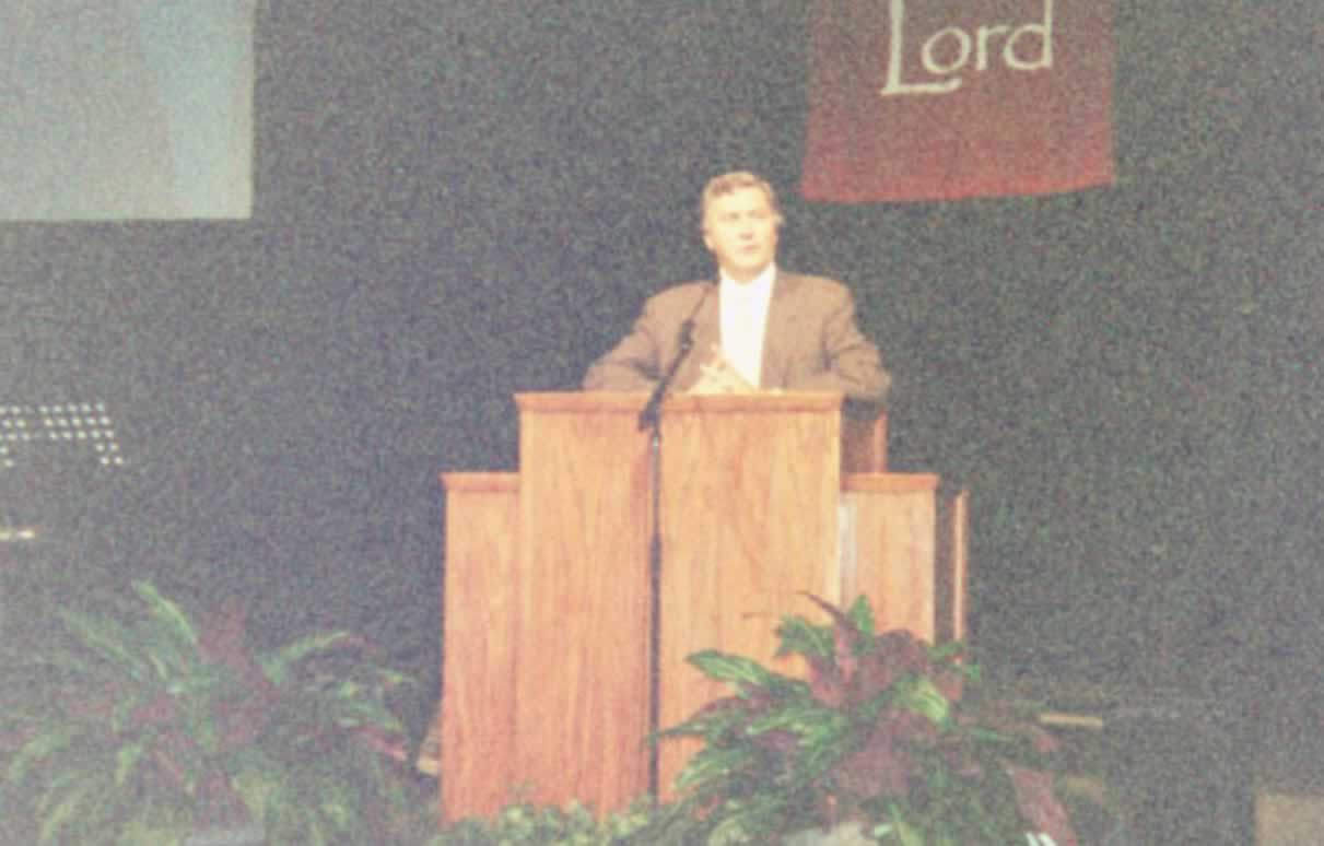 picture of Paul Marshall standing behind a podium speaking