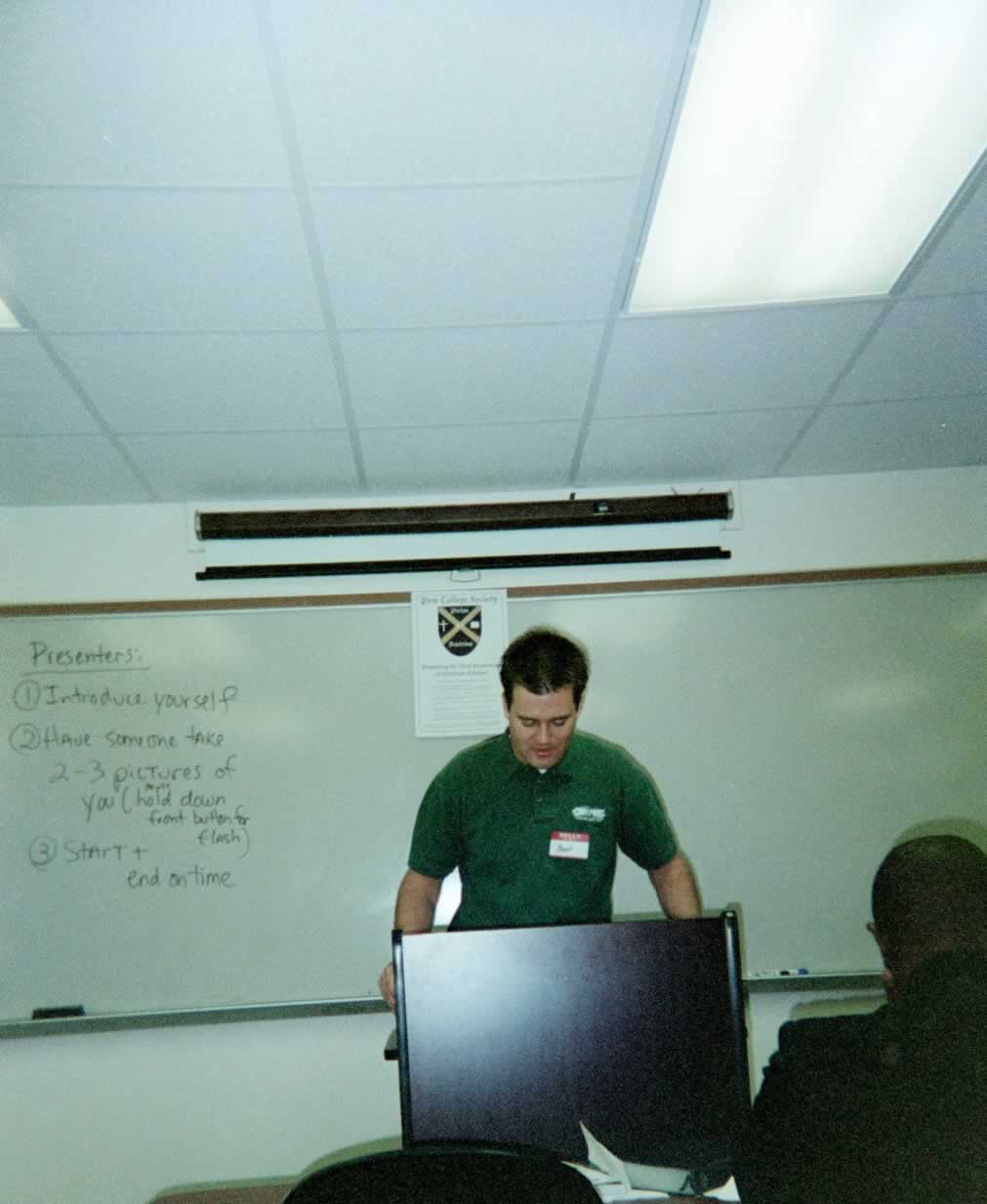 picture of a man standing behind a podium