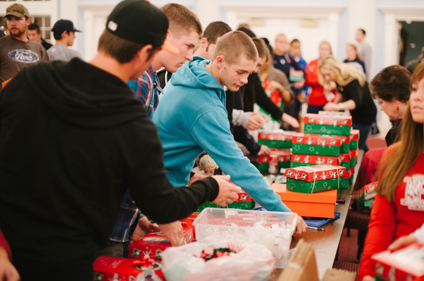 Students packing Operation Christmas Child boxes