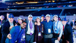 Keon Byrd with team members at Dallas Cowboys Stadium.
