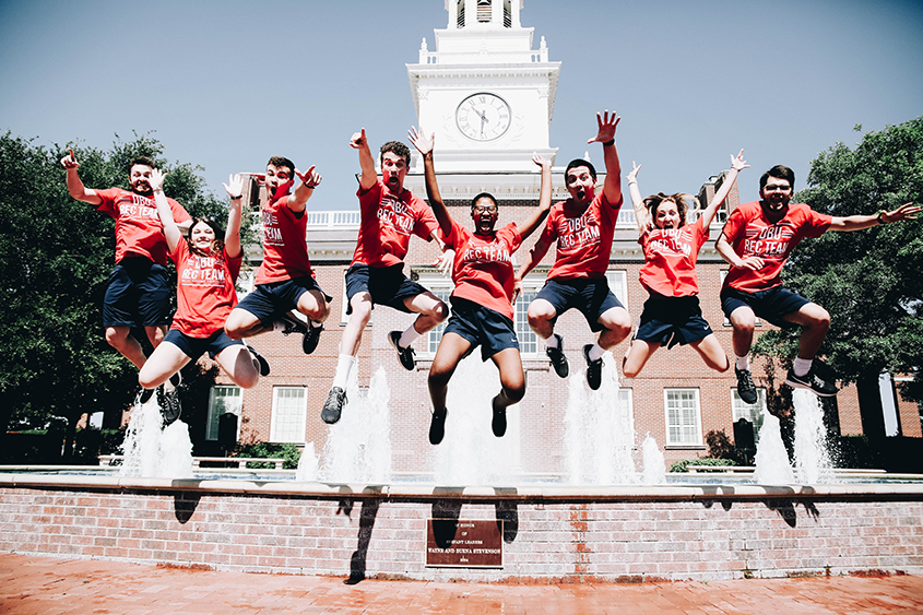 The Rec Team jumps off the fountain in front of the Mahler