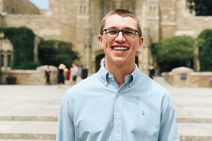 Blake stands outside of the Yale School of Medicine