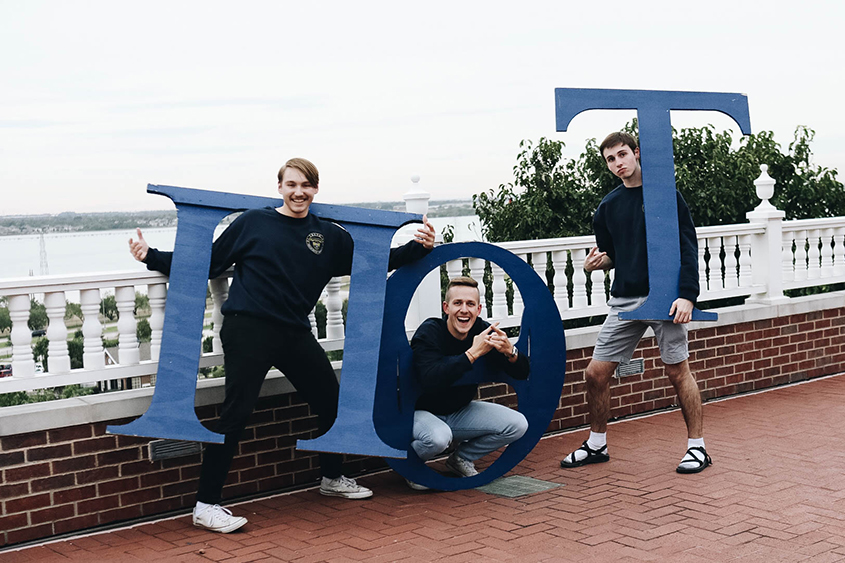 Pi Theta Tau boys pose with their Greek letters