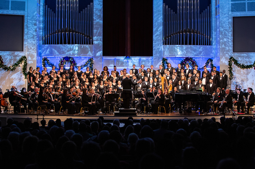 The DBU Grand Chorus performs on stage in the Chapel with a full orchestra, conducted by Dr. Stephen Holcomb