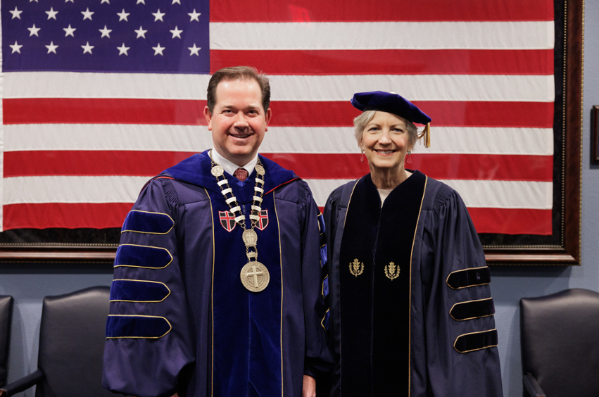 Standing in front of the American flag, Dr. Wright and Shirley Hoogstra - Dallas, Texas