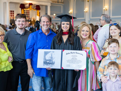 DBU student graduate in the Hillcrest Great Hall during Summer Graduation