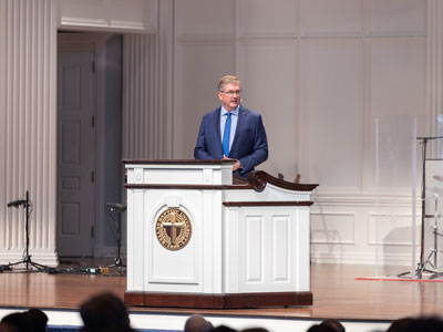 Dr. Ronny Marriott speaking in the Pilgrim Chapel at Dallas Baptist University