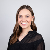 Headshot of Cora Moncibaiz