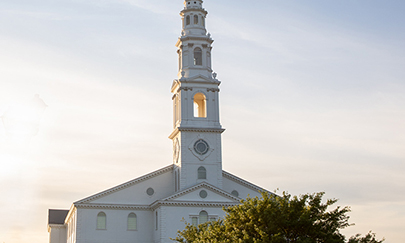 the steeple of the DBU chapel at the beginning of sunset