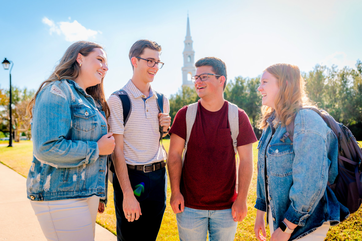 group of college students standing outside and talking at a Christian University in Dallas, Texas