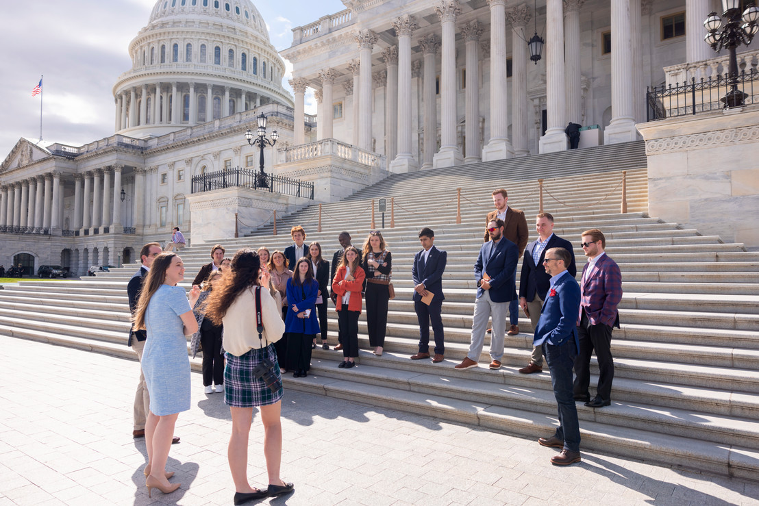 College students standing in front of the United States Capitol Building in Washington D.C.