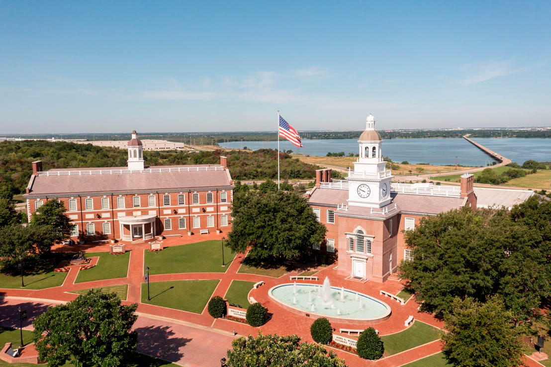 aerial view of campus buildings with an American flag at a Christian college in Dallas, Texas