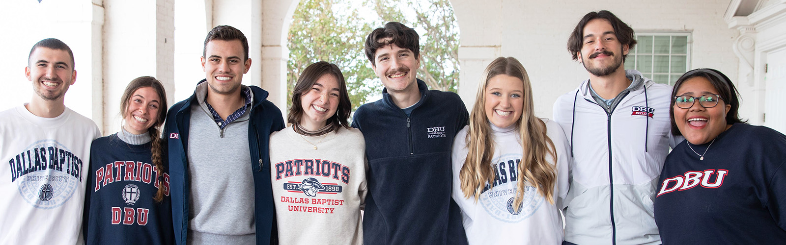 dallas college students standing together at DBU campus