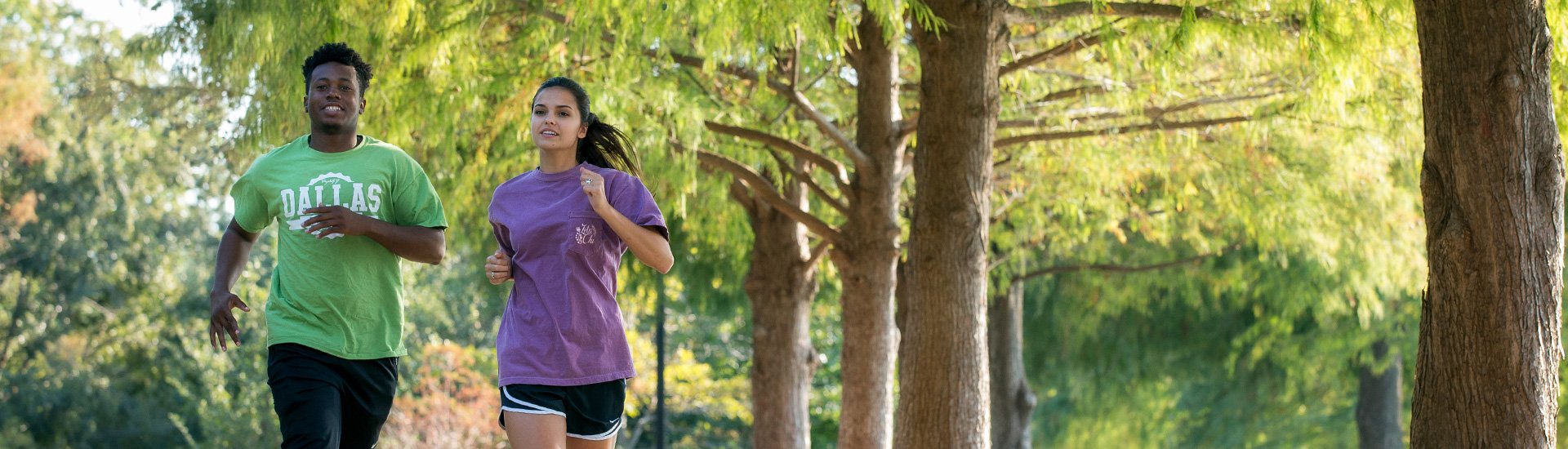 Students running around the Pond