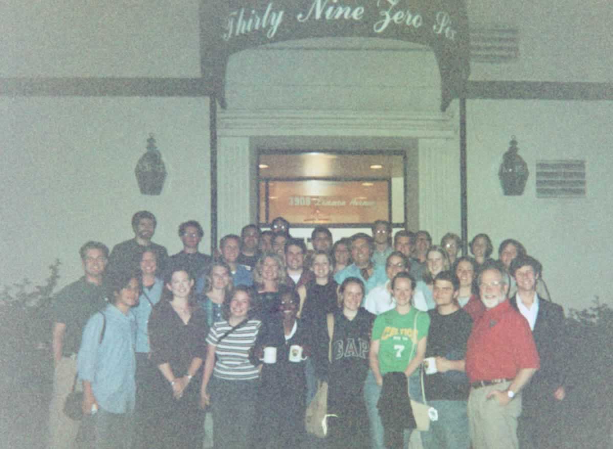 picture of a group of students standing with Dr. Naugle outside of a restaurant
