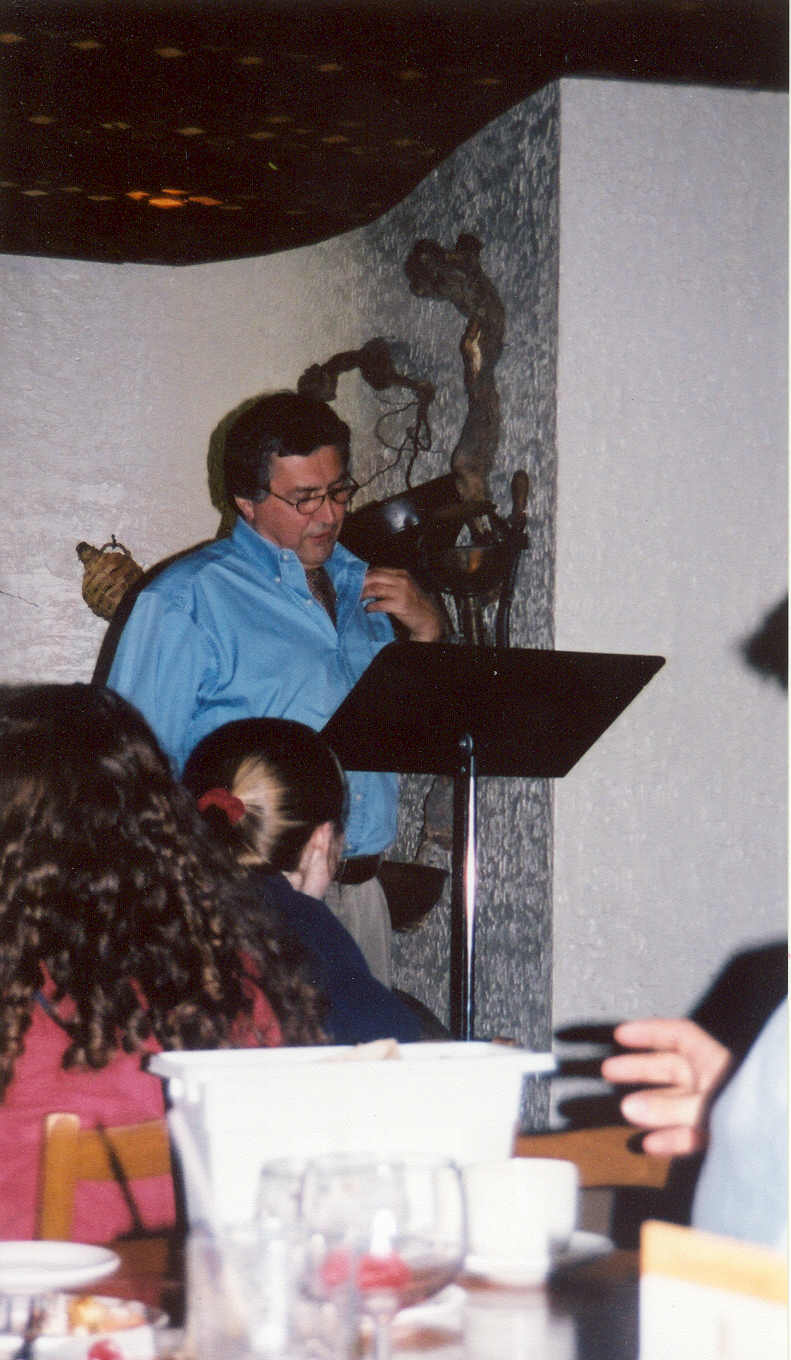 picture of Paul Marshall standing behind a music stand speaking