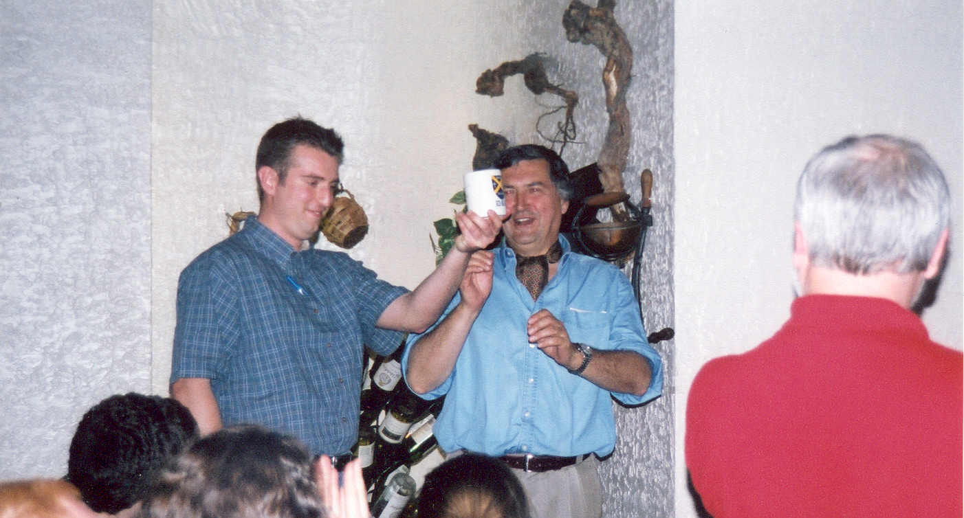 picture of Paul Marshall with a student holding a mug