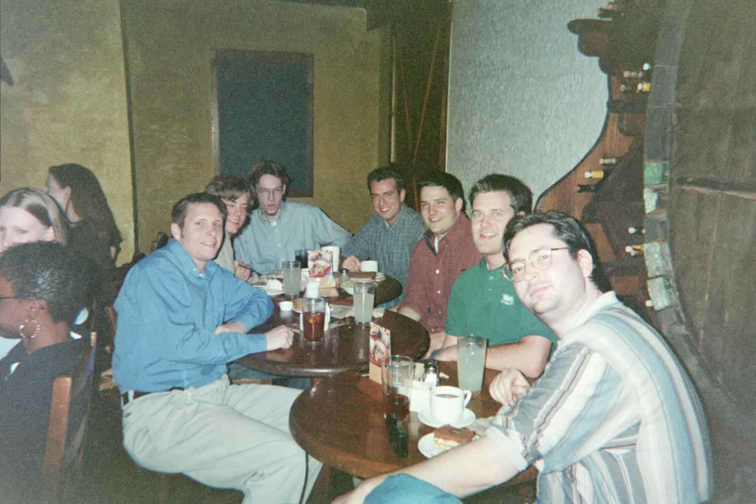 picture of a group of men sitting around a table