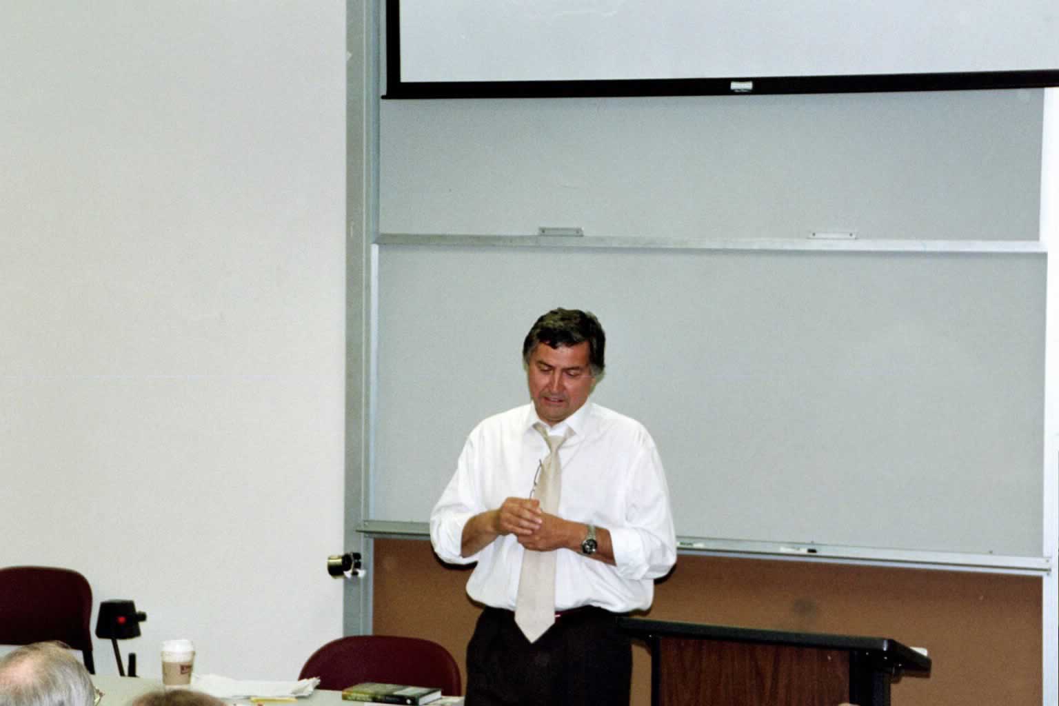 picture of Paul Marshall standing in front of a room speaking