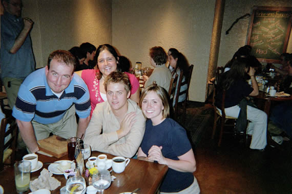 picture of two women and two men sitting at a table in a resturant