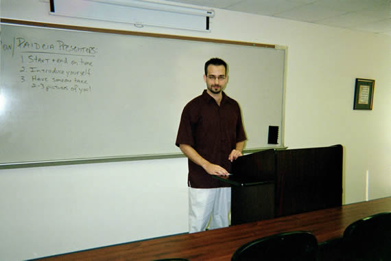 picture of a man standing infront of a podium