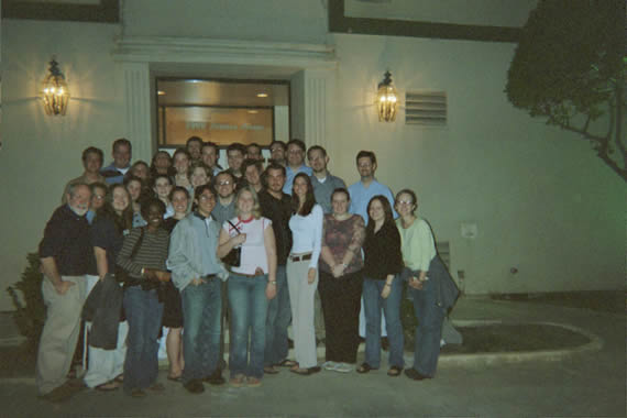 group picture of students gathered around the outside of a building