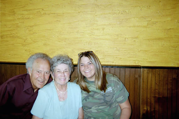 picture of two women and one man smiling together