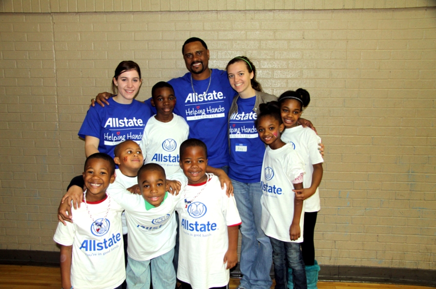 DBU swim team members Rebecca Steele (left) and Amy Brewer (right) pose with National Give Back Day Hero John Darjean (center) and several children that they worked with on Martin Luther King, Jr. Day.