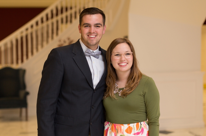 Staci Beene and Jacob Alger standing together in the chapel foyer. 