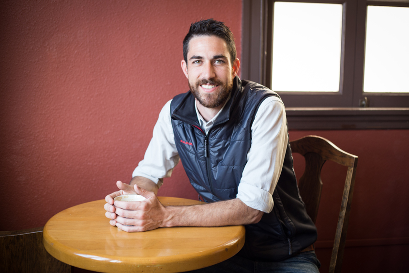 Doug Hewitt sitting at a table with coffee