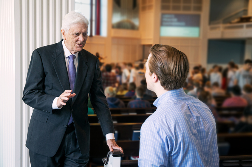 Dr. Daehnert encourages one of his students before chapel