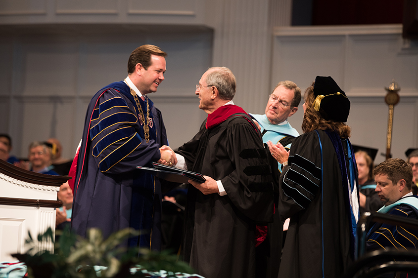 Dr. Jorge Juan Pastor shakes Dr. Adam Wright's hand as he receives his honorary doctorate degree