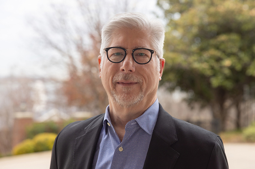 headshot of Kenneth Koester standing outside in Dallas