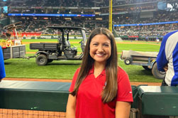 DBU student Alexis Delagarza at Globe Life Field interning as a part of the Charley Pride Fellowship