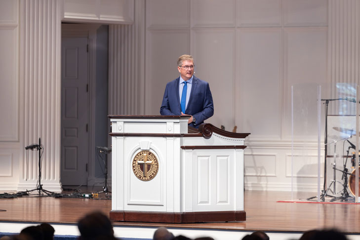 Dr. Ronny Marriott speaking in the Pilgrim Chapel at Dallas Baptist University