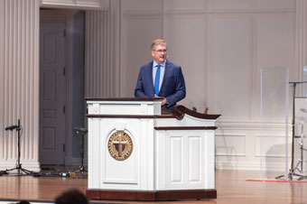 Dr. Ronny Marriott speaking in the Pilgrim Chapel at Dallas Baptist University