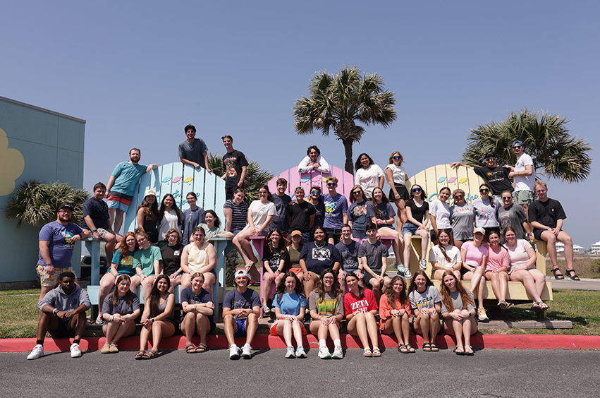 Spring Break Trips - group of DBU college students standing together in South Padre, Texas