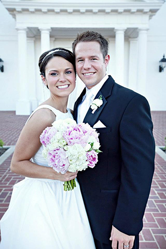 Tyler and Katee's standing outside the Pilgrim Chapel on their wedding day
