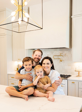 Tyler and Katee Haile in their kitchen with their kids
