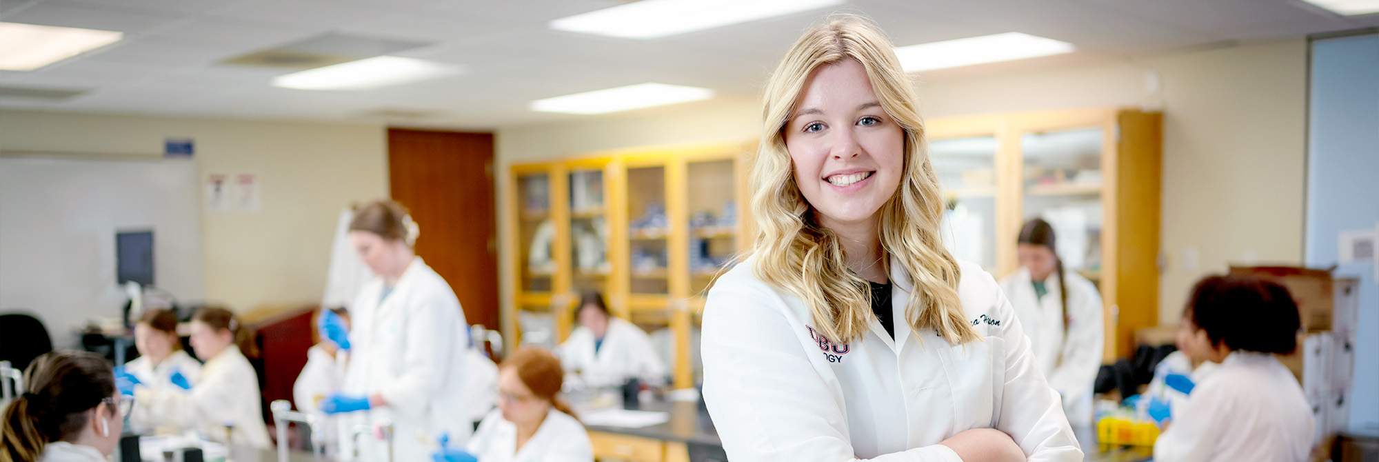 med student smiling in classroom