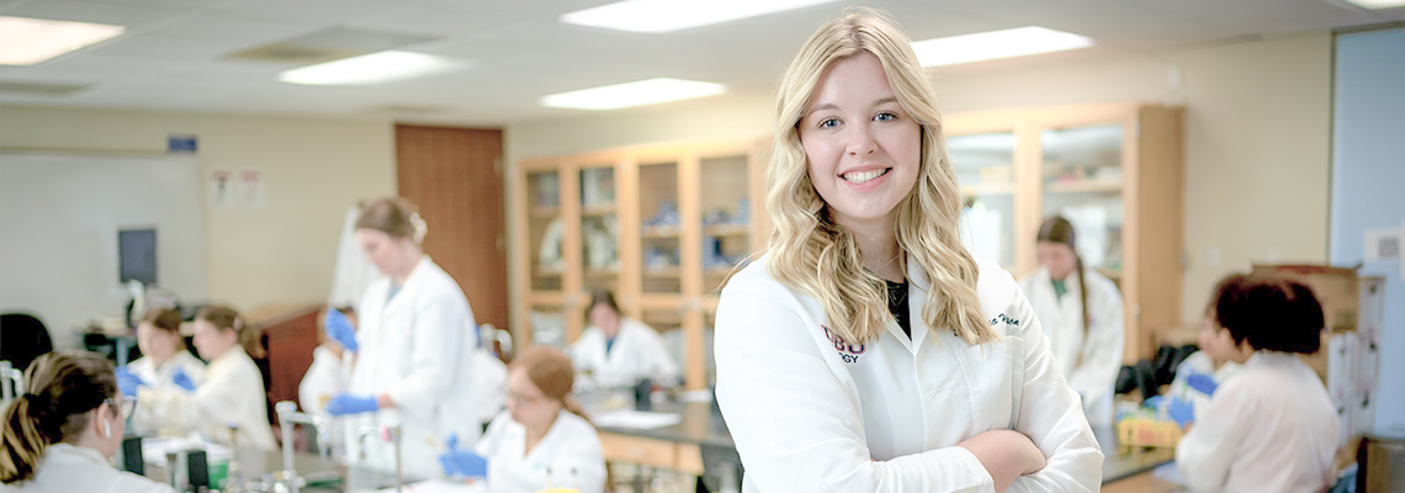 med student smiling in classroom