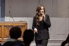 student speaking on a stage